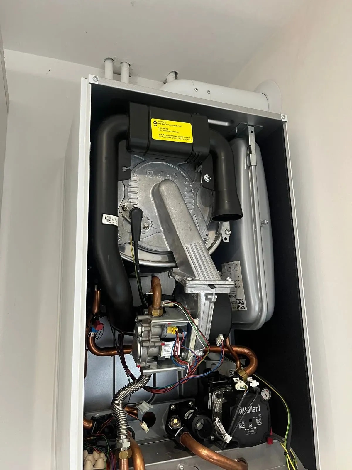 Gas engineer servicing a boiler